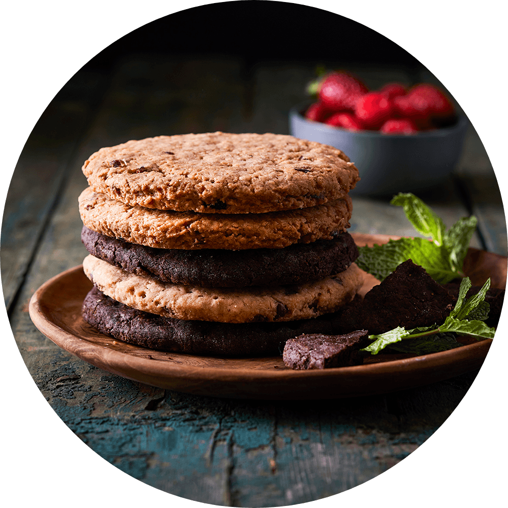 A stack of chocolate cookies on a plate